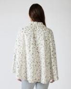 Short women's poncho with button closure